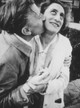 Black and white photograph of Anni Albers and her husband Joseph Albers, capturing a tender moment as Joseph kisses Anni’s cheek.